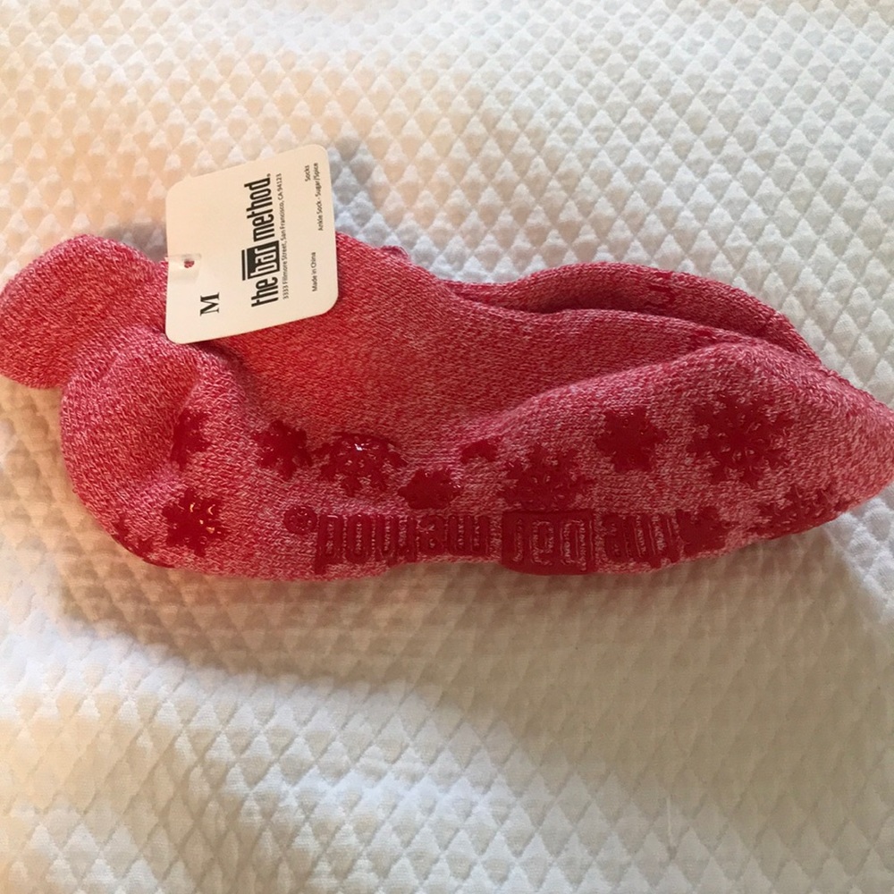 Holiday/winter-themed red The Bar Method socks